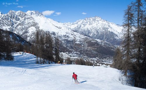 View over Puy-Saint-Vincent with skier