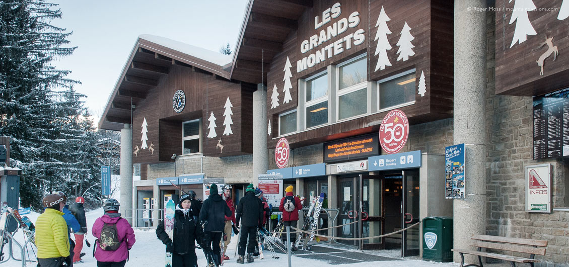 Skiers walking to Grands Montets ski-lift entrance.