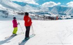 View of two skiers looking at spectacular mountain scenery