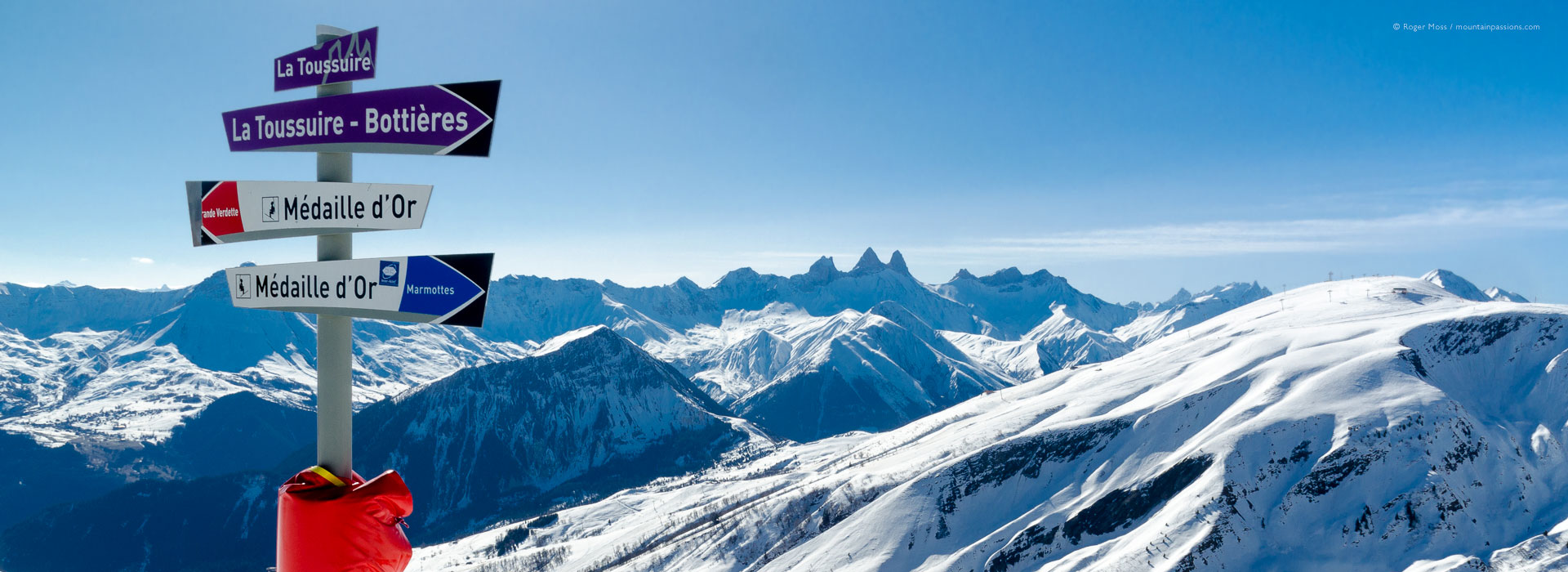 Ski signage with mountain scenery at La Toussuire, Les Sybelles