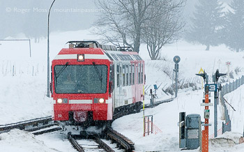 Mont-Blanc Express train arriving at Vallorcine with falling snow