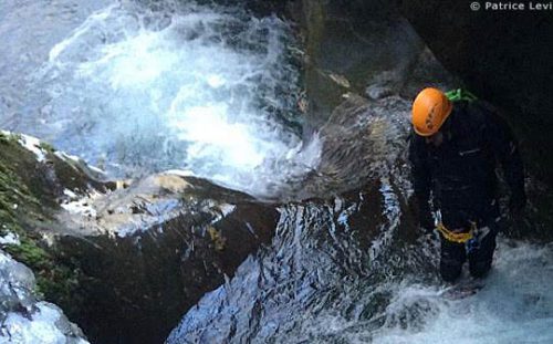 person about to jump into pool, winter canyoning