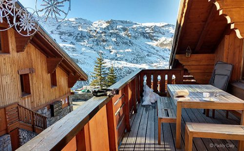 View from hot tub of chalet balcony and snow-covered mountains, Les Menuires