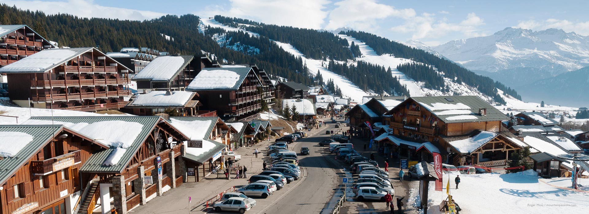 Overview of Les Saisies village centre, with road and cars