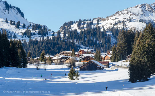Long view of Praz de Lys ski village, with cross country skiers