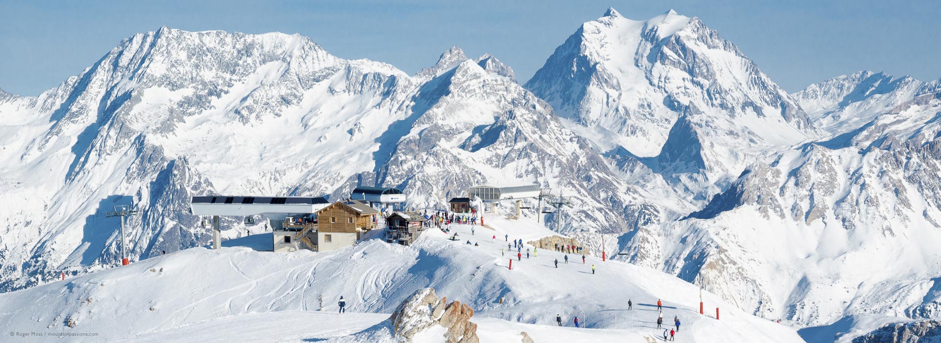 Long view of mountains with ski lifts at Courchevel, 3 Valleys, French Alps