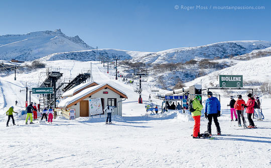 View of skiers beside ski-lifts at Combe de Beaudin, Valmorel, French Alps.