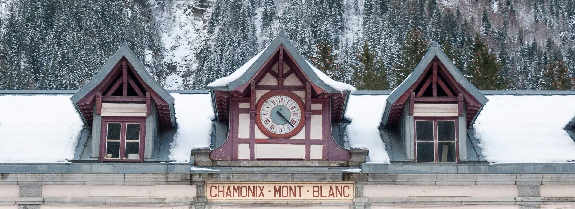 Snow-covered roof of Chamonix Mont-Blanc Gare SNCF, French Alps.