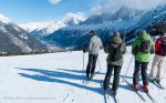 Group of skiers overlooking the Chamonix Valley, French Alps.