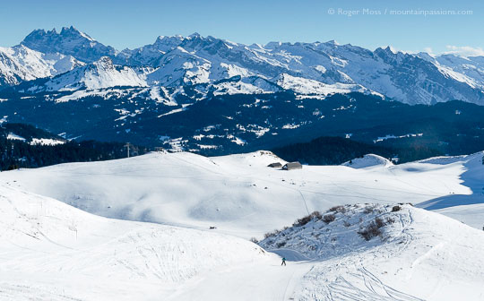 High view of skier on lower section of Lac piste at Praz de Lys Sommand, French Alps.