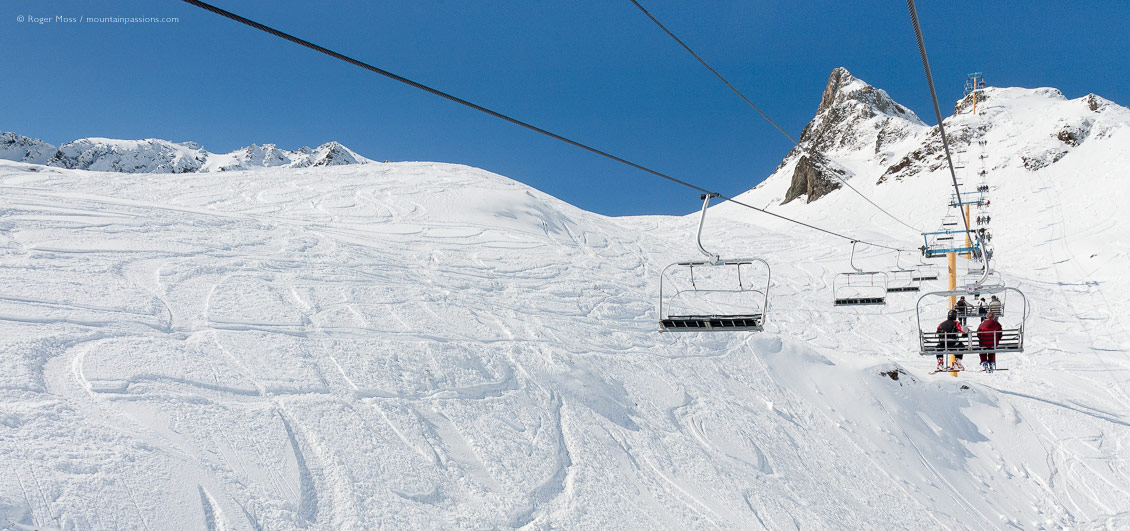 Skier's-eye view of snow-covered mountainside from from chairlift at Luz Ardiden, French Pyrenees.
