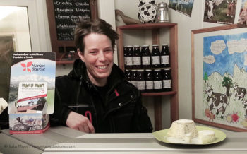 Artisan cheese producer Aurore Delesmillieres in her farm shop, Samoens, French Alps