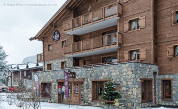 Exterior view in snow of CGH Les Chalets de Layssia ski apartments, Samoens, French Alps