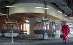 Skier leaving Grand Massif Express ski lift at Samoens, French Alps.