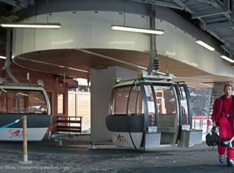 Skier leaving Grand Massif Express ski lift at Samoens, French Alps.