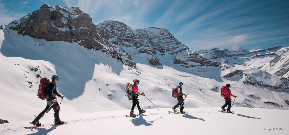 Group on a guided snowshoe walk, French Pyrenees. Image © O.Guix