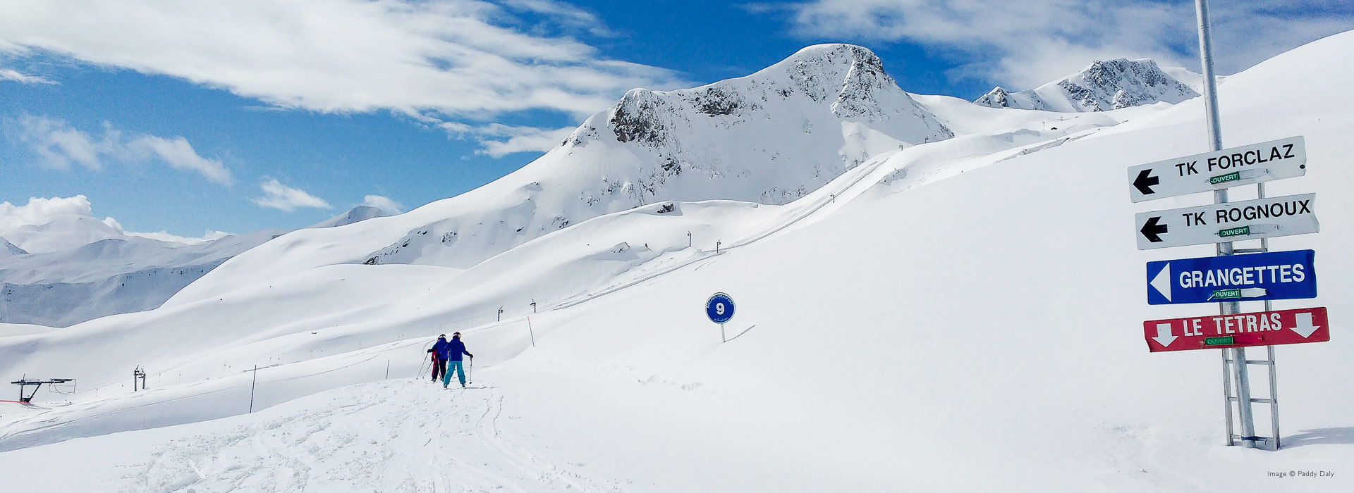 Two skiers on fresh snow in Areches-Beaufort, French Alps