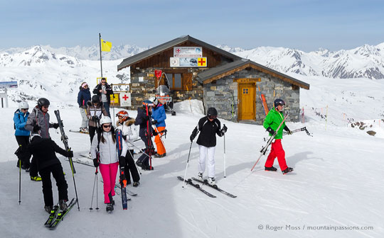 Group of skiers beside mountain rescue point
