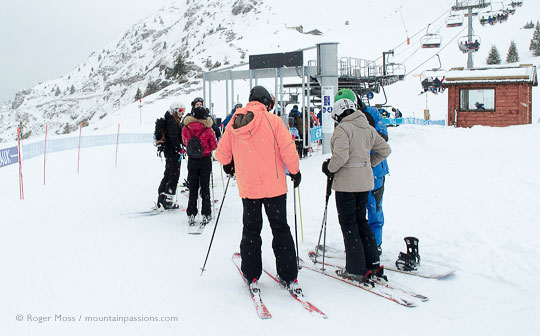 ski-lift with skiers at Les 7 Laux