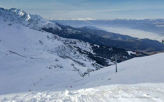 wide view of early morning ski piste and mountains