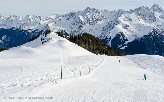 High view of skiers on wide piste