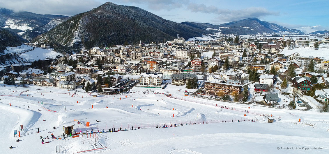 Overview of luge park and snow-dusted village of Villard de Lans, French Alps
